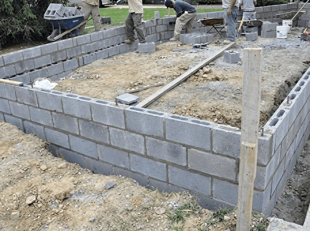 Professionals building a foundation with blocks in Boulder, CO